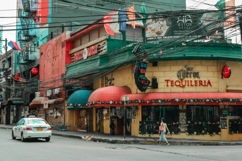 the corner store has a red and green awning