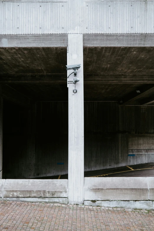 the front of a white building and parking spaces