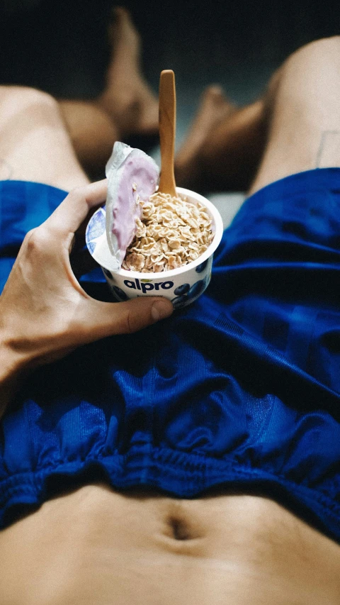 a woman with  on eating an ice cream sundae