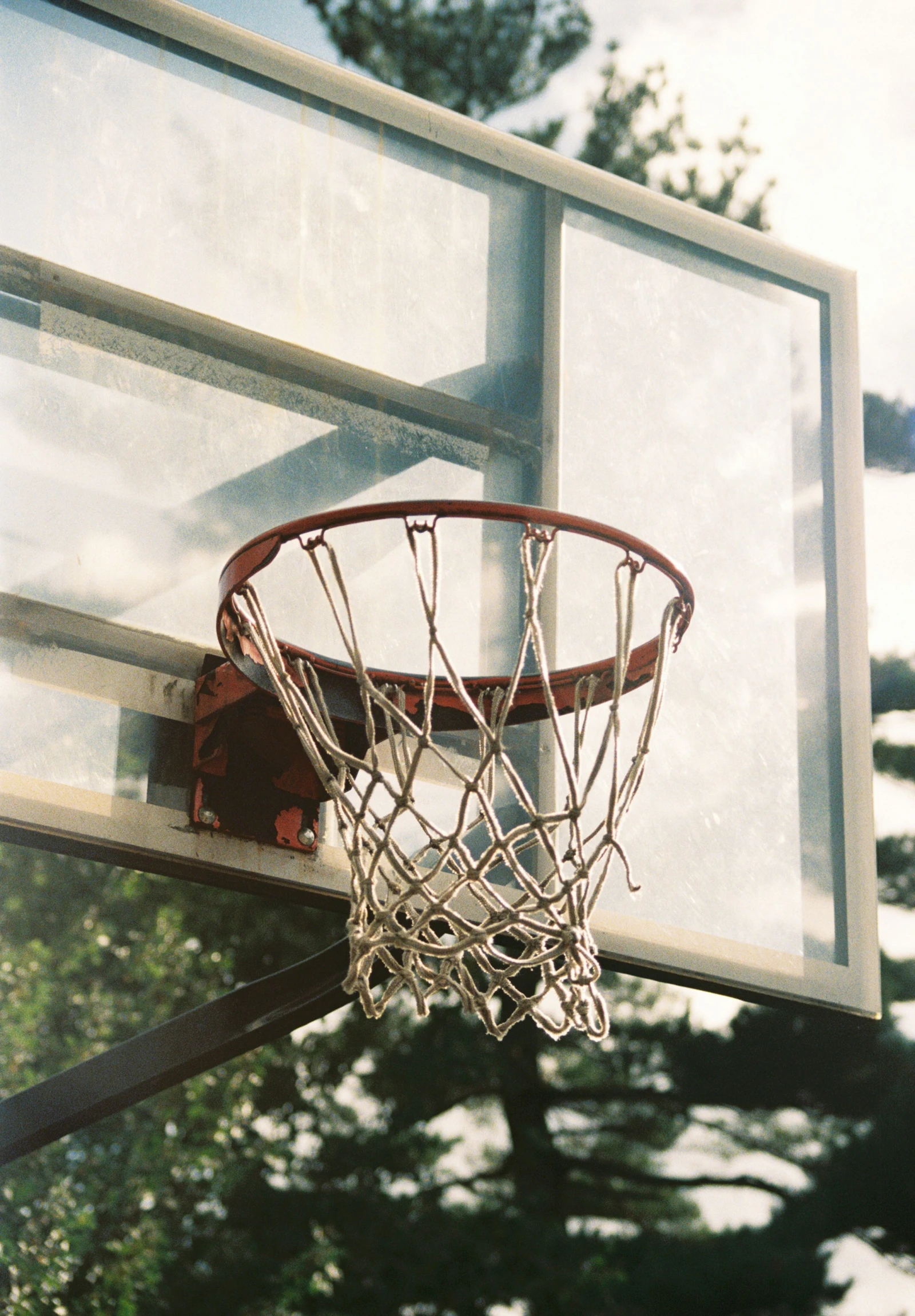a basketball hoop that is open on a basketball court