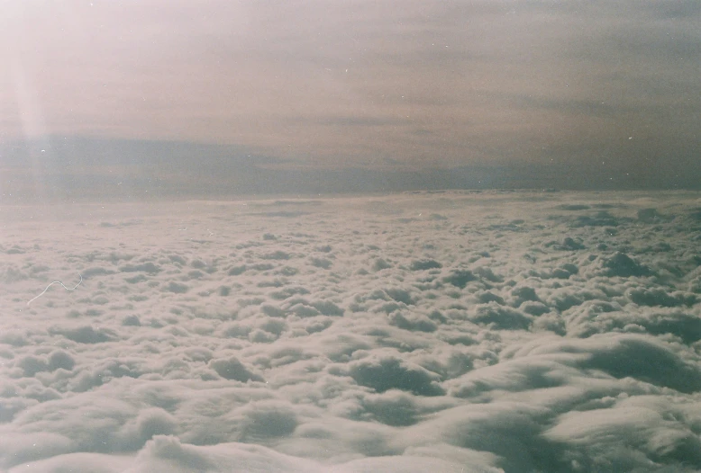 clouds are seen from above on the airplane