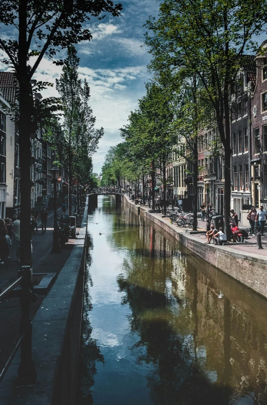 a small canal running between two buildings on either side of it