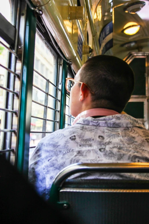 a person sitting in a chair on the bus