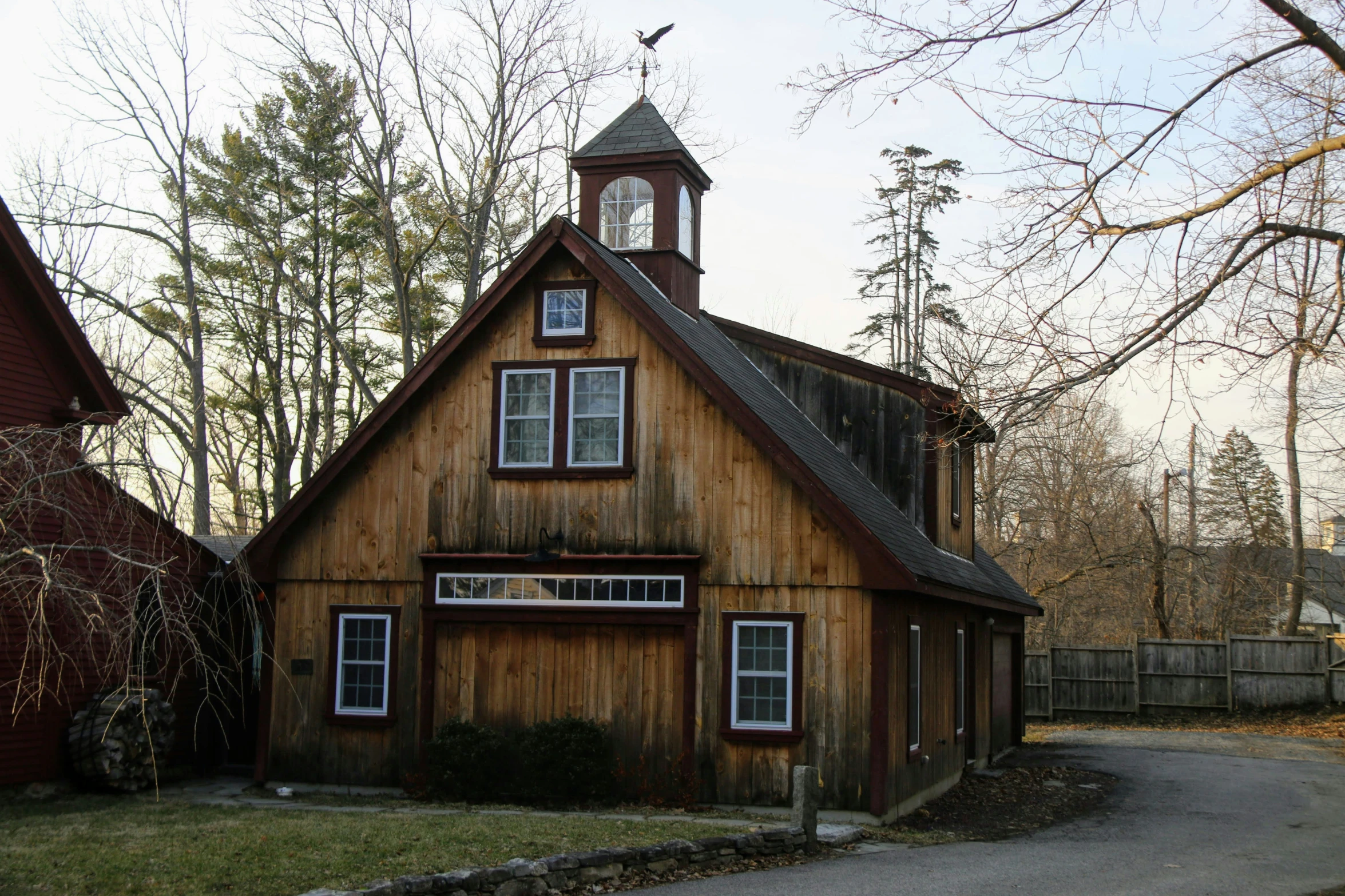 a old barn has a steeple on the roof