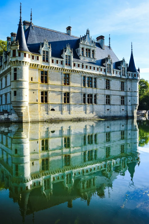 the building on the water has many windows