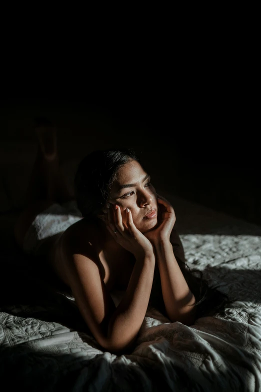 a  woman sitting on top of a bed