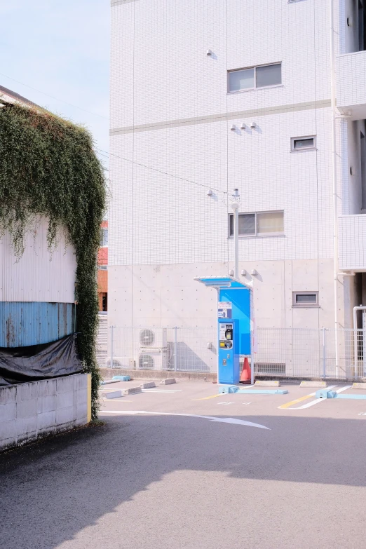 an empty parking lot next to a building