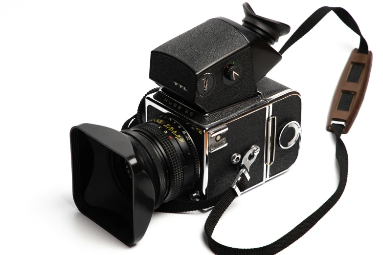 an old camera with a brown strap and some lights