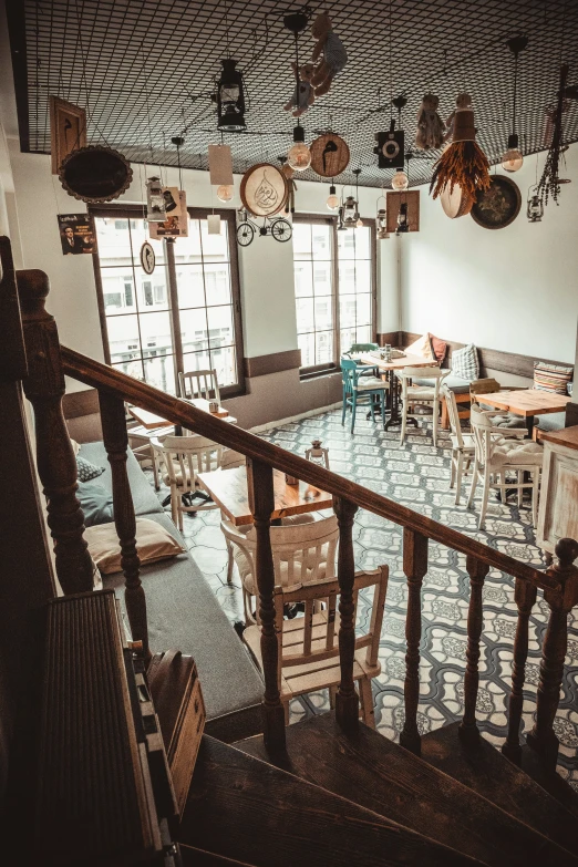 an old - fashioned restaurant with several wooden tables