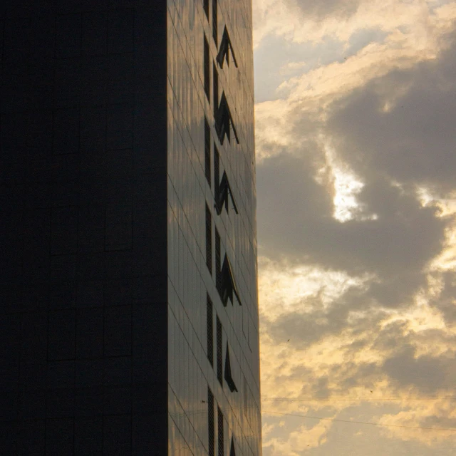 a sky view of a building and clouds