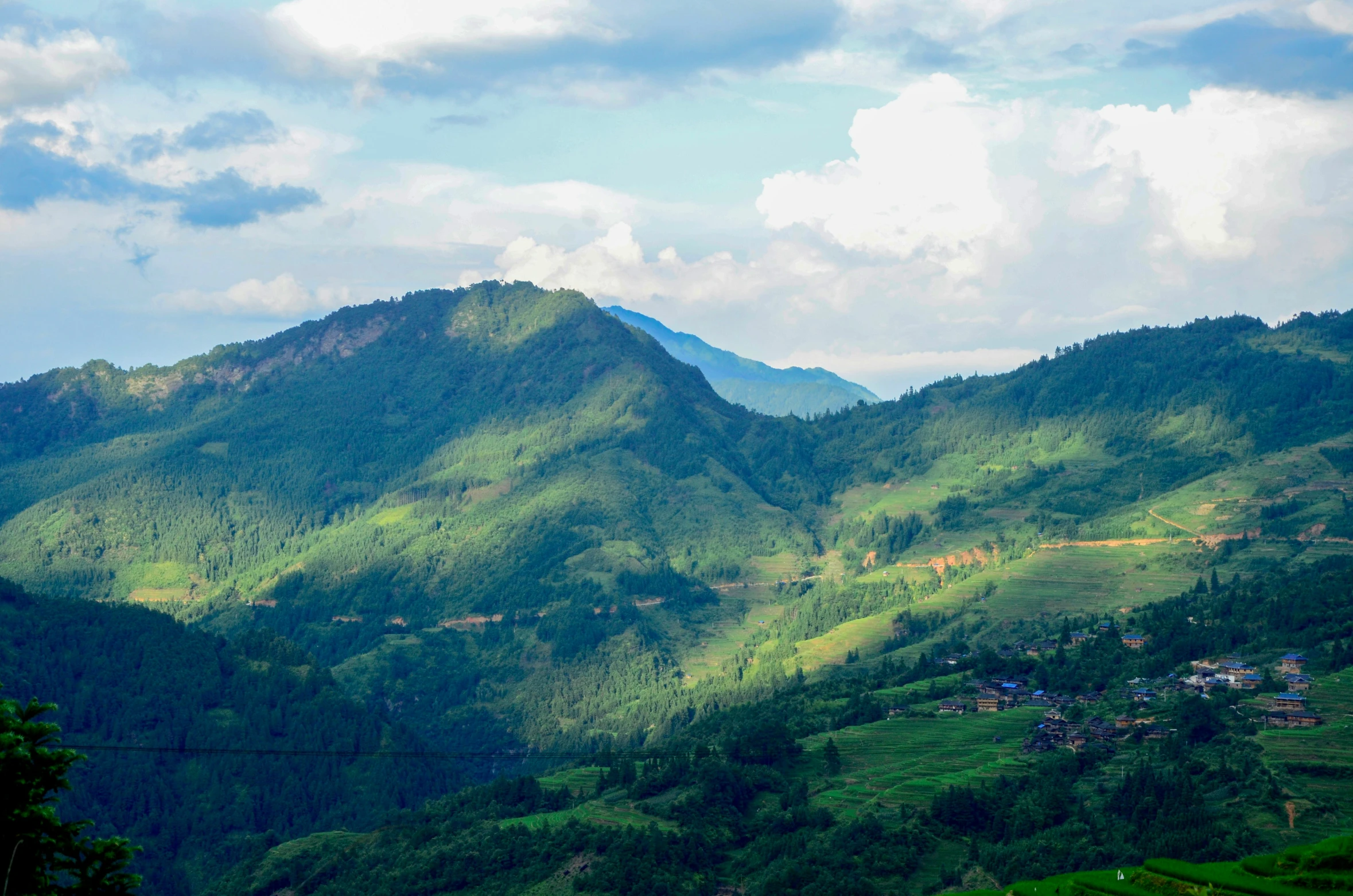 a view of some very pretty mountains in the day