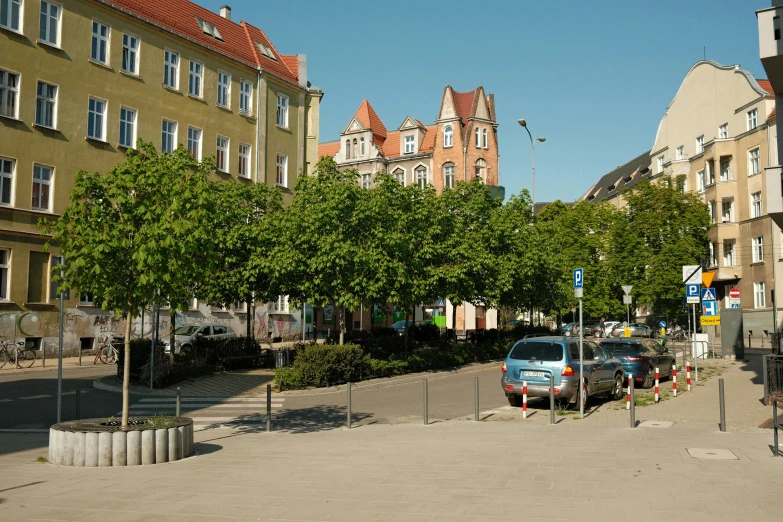 a po of some cars parked near buildings