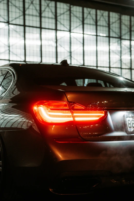 a bmw car with its back lights on