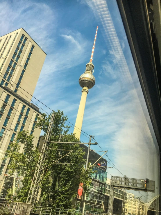 a large television tower towering over the city