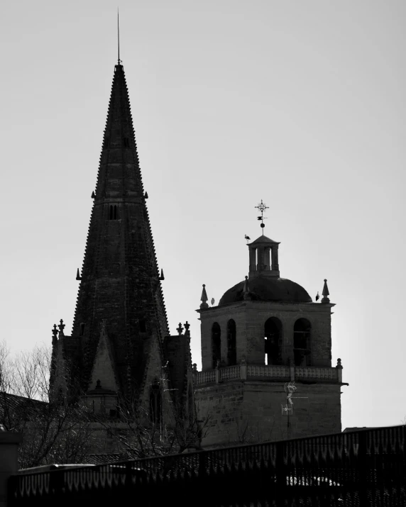 an old cathedral with two bell towers towering in the sky