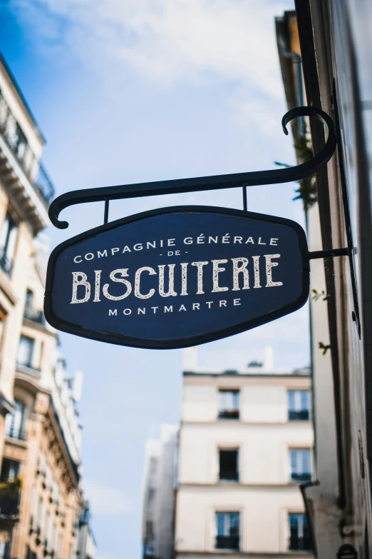 an outdoor sign in front of some buildings