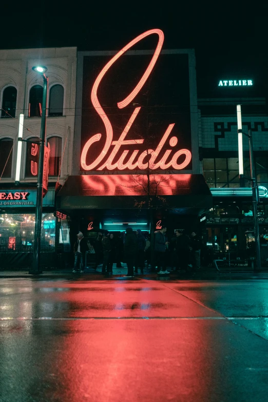 an illuminated sign on the side of a building