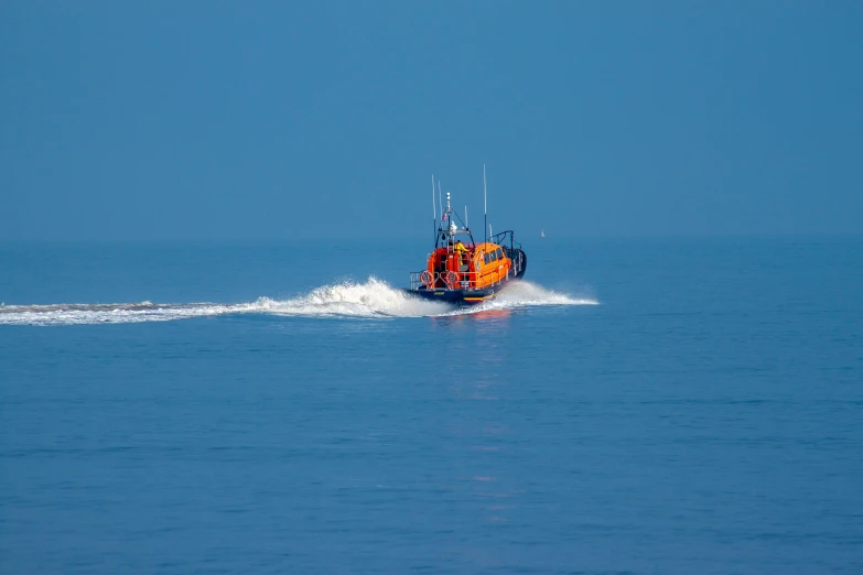 a man on a boat speeding in the ocean