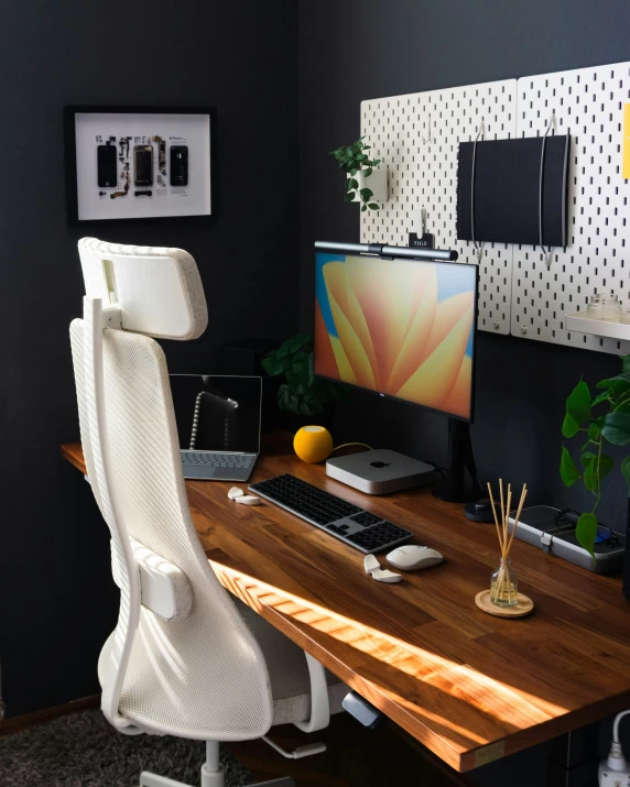 a home office that has been painted in a dark tone