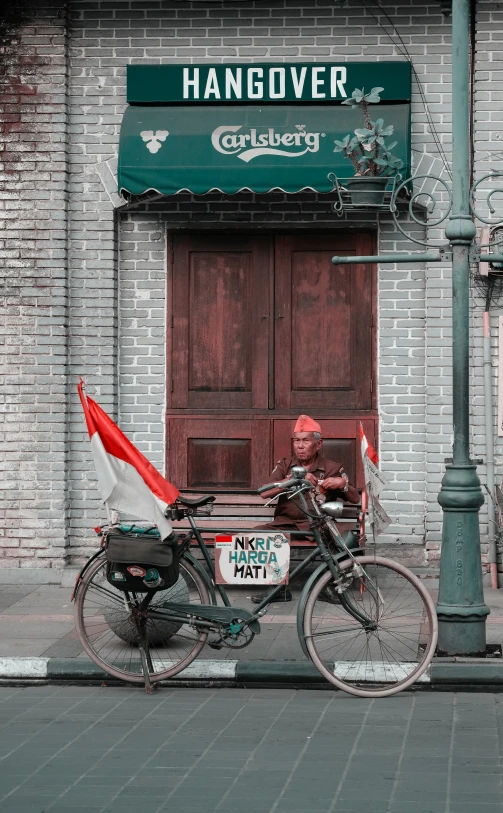 a bike parked in front of a building with a sign that says hangover