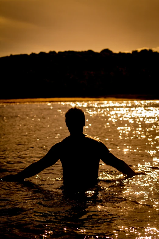 a person that is wading in the water