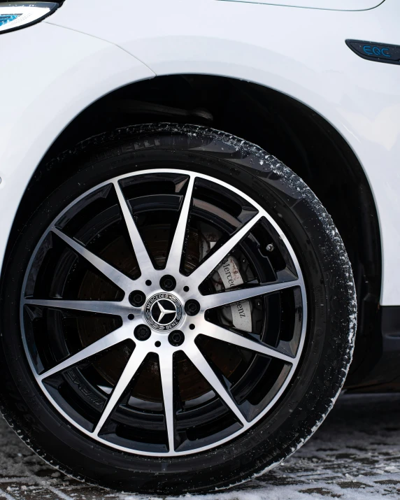 the rim on a vehicle parked in the snow