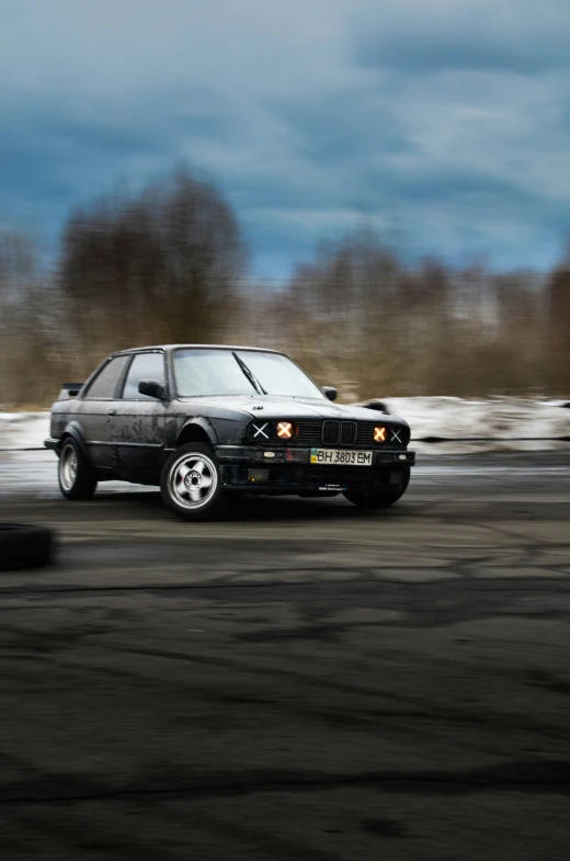 an automobile drives along the road at high speed