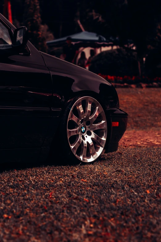 a black car with a red ke and some other vehicles