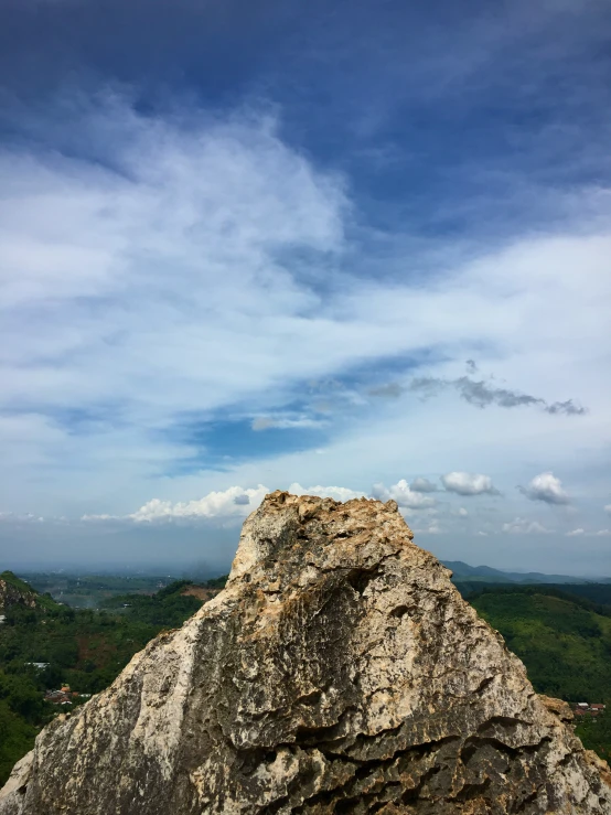 the man on the top of a rock alone