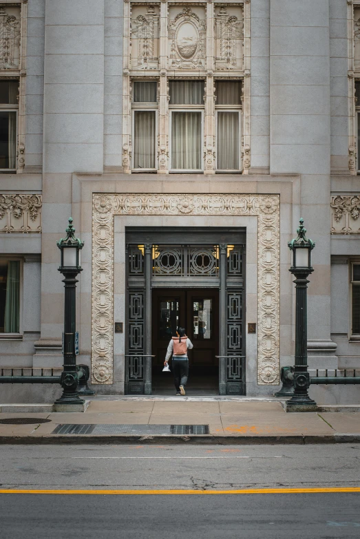 a couple in front of a building with a traffic light