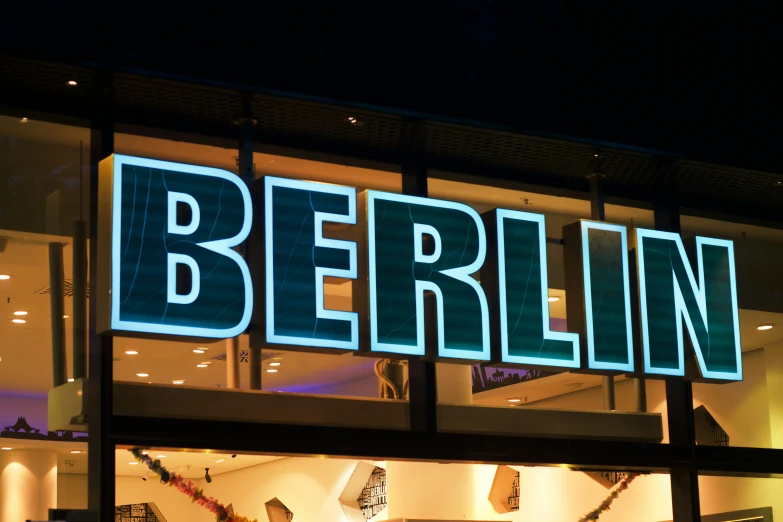 a lit up store front showing the windows