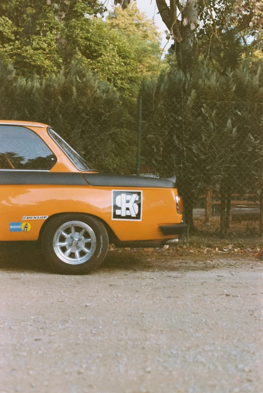 an orange truck has its number 53 on the side of it