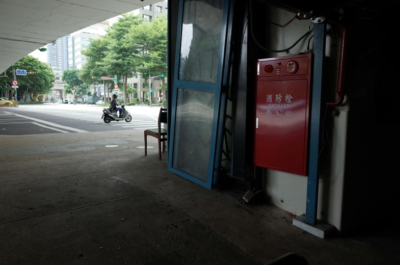 there is a motor bike parked outside the door to a building