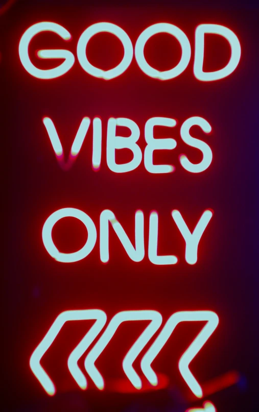 a neon sign that says good vibes only on a black background