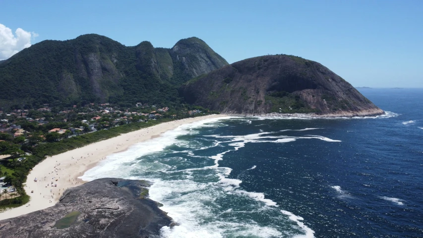 an image of a beach and mountain on the coast