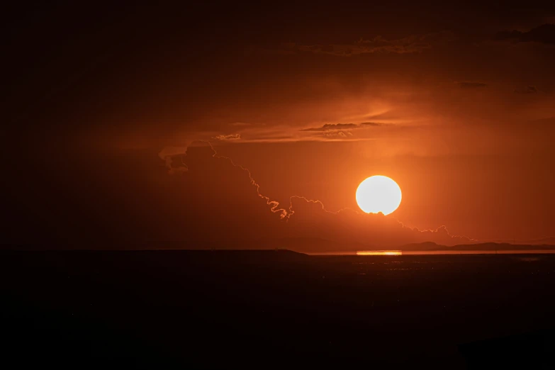 a beautiful sunset with the sun reflecting in water