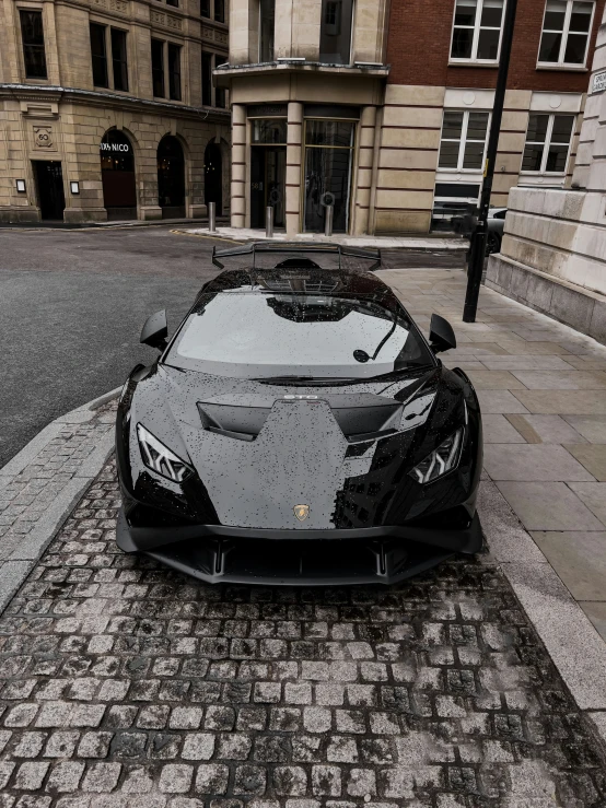 an elegant car is parked on the pavement