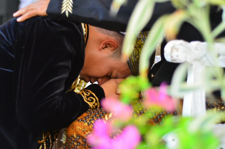 two men dressed in mexican costumes kissing