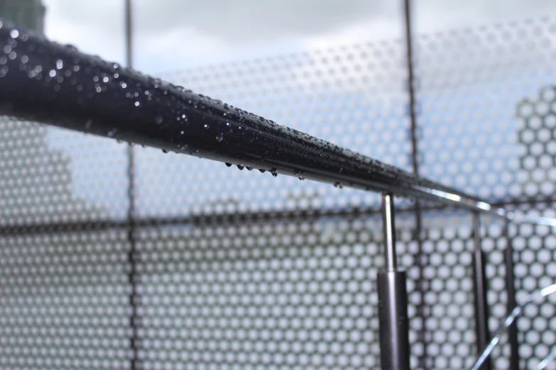 a fence that has water on it