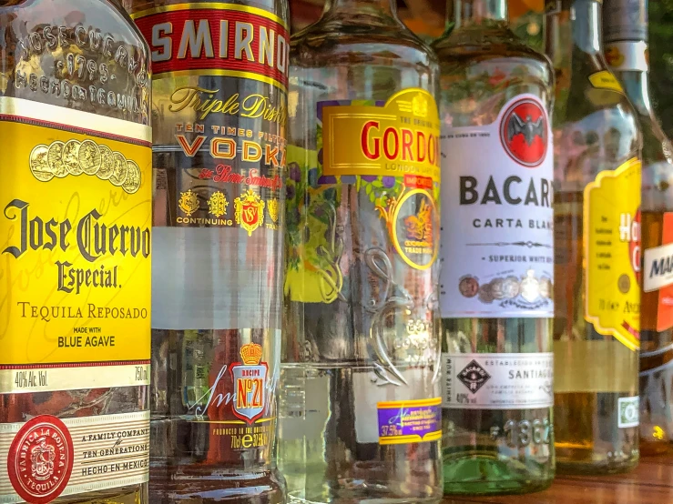 a row of liquor bottles on a table