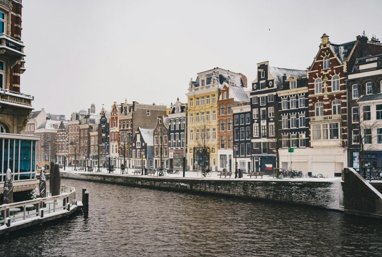 an image of an old city scene with water