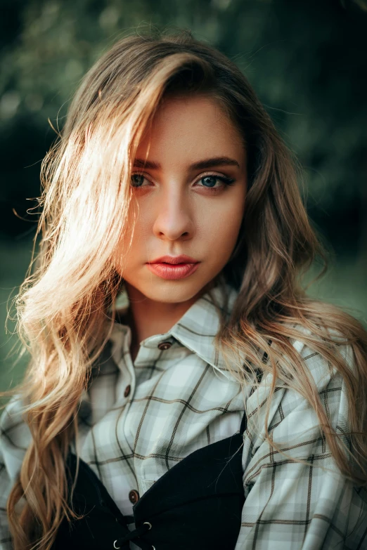 an adorable blond woman with long hair looking into the camera