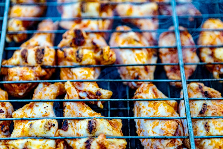 a close up of food on a grill cooking