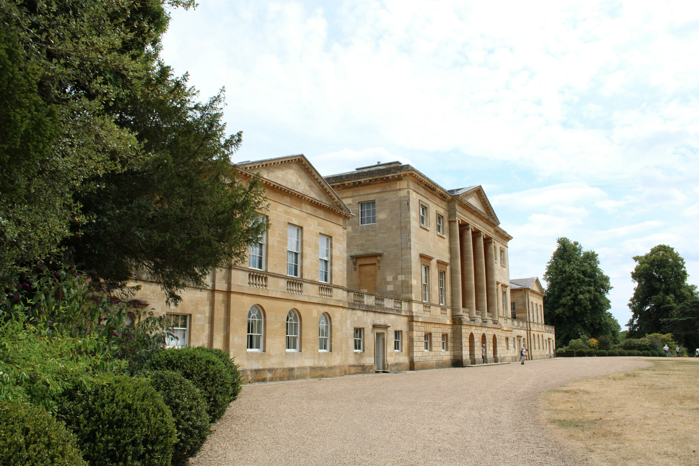 this big house has a stone driveway by it