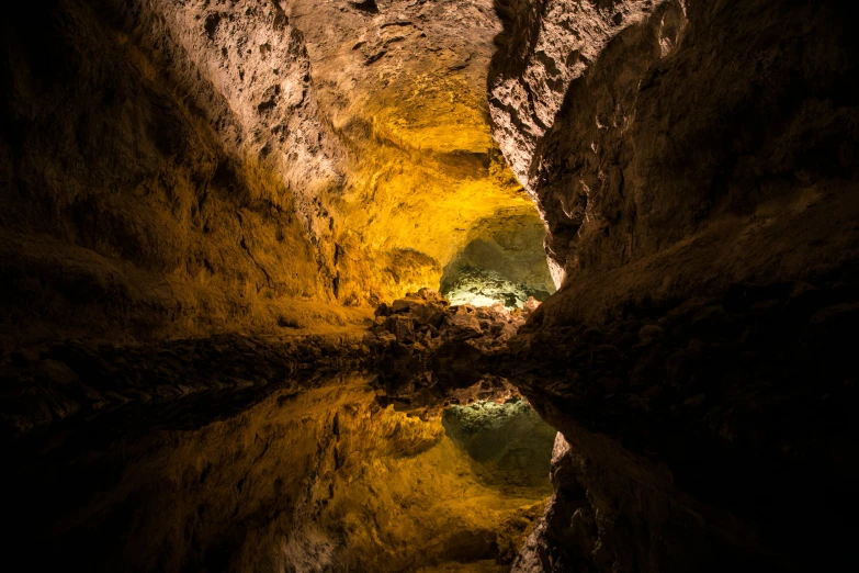 an image of a cave setting with lights in the ceiling