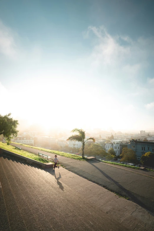 a person on a skateboard near a paved path