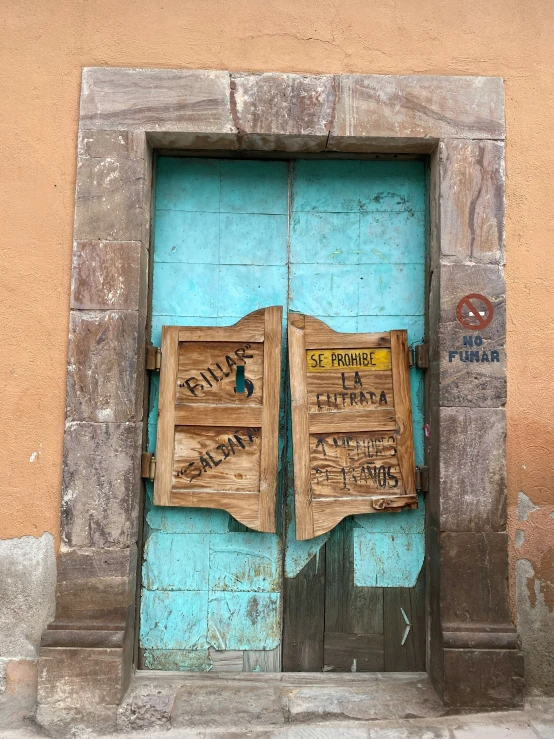 closed up doorways and door frames with graffiti