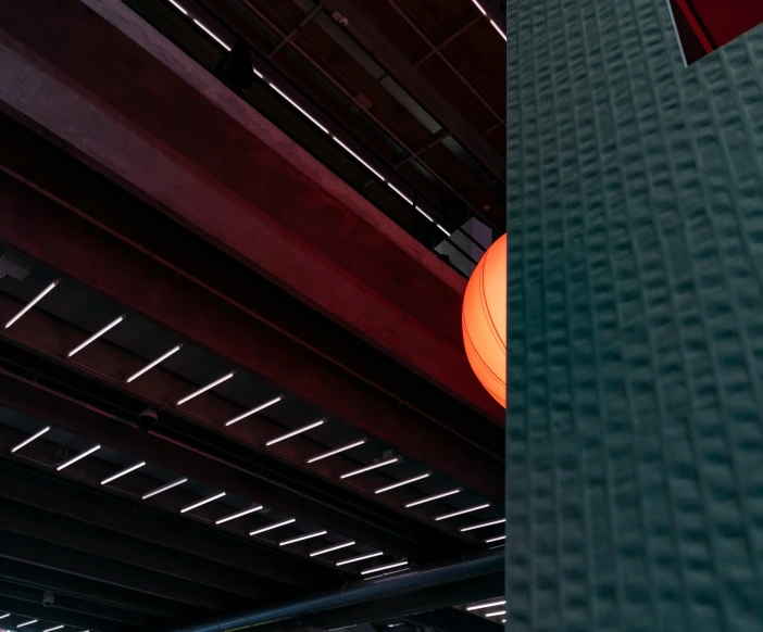 an orange object is hanging in an industrial building