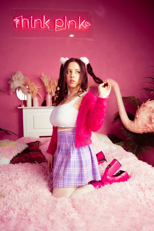 a person posing in a pink room with flamingos