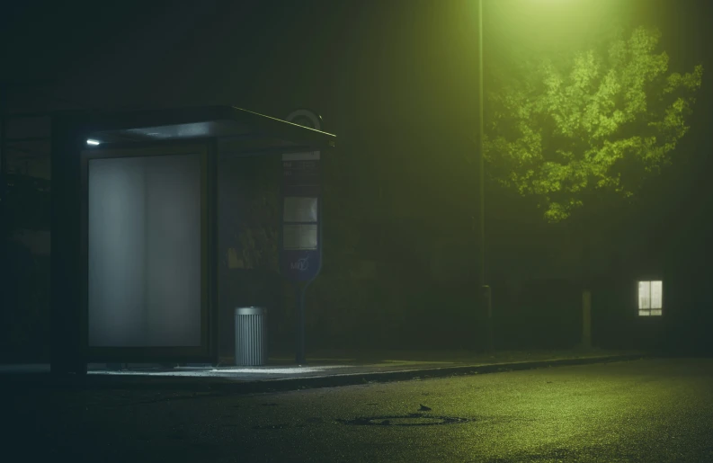 a very tall phone booth in the dark